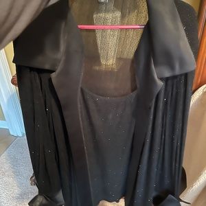 Elegance sparkly woman's long sleeve blouse. Tank underneath is attached.